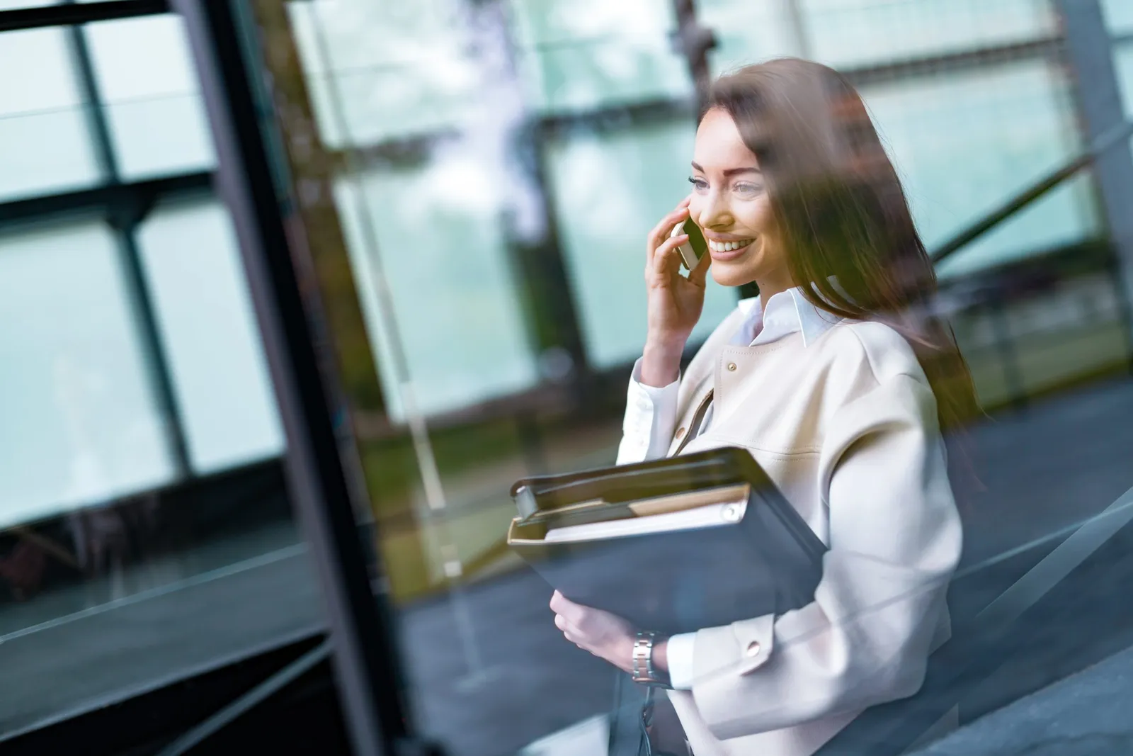 Portrait of young beautiful businesswoman going to office